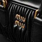 miu-miu-black-matelasse-leather-top-handle-bag Handle